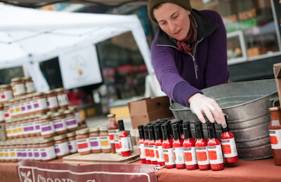 A vendor organizes her wares